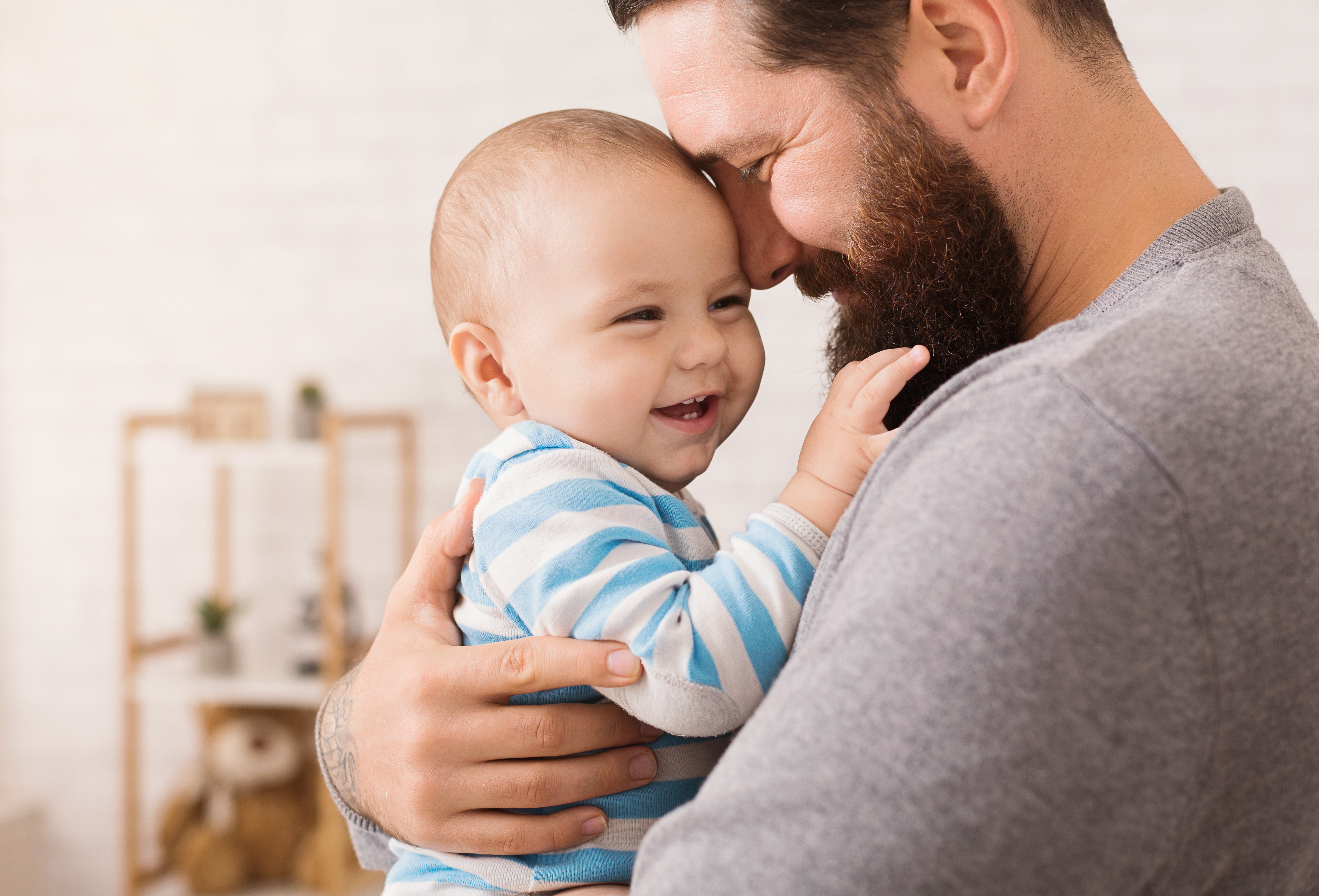 dad holding baby